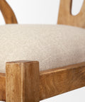 Close-up of a wooden chair with a beige cushion on a white background