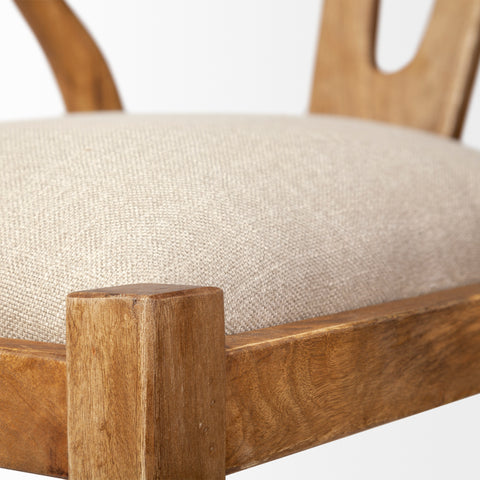 Close-up of a wooden chair with a beige cushion on a white background
