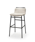 White bar stool with black metal legs on a white background