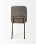 Chair with gray cushioned backrest and wooden legs on a white background