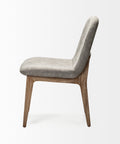 Gray upholstered chair with wooden legs on a white background
