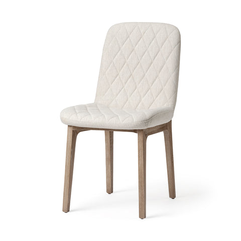 White quilted chair with wooden legs on a white background