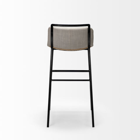Bar stool with gray cushioned seat and black metal frame on a white background