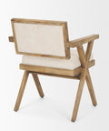 Wooden armchair with beige cushion on a white background