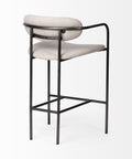 Bar stool with black metal frame and beige cushioned seat on a white background