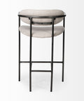 Two bar stools with beige cushioned seats and black metal frames on a white background
