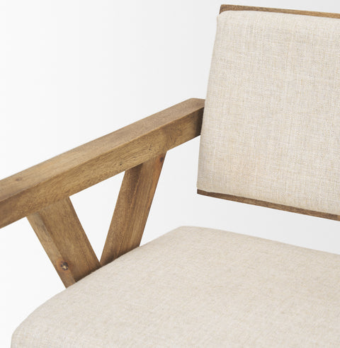Chair with wooden frame and beige cushion on a white background