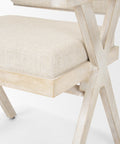 Chair with wooden frame and beige cushion on a white background