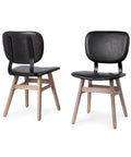 Two black chairs with wooden legs on a white background