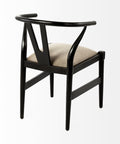 Black chair with beige cushion on a white background