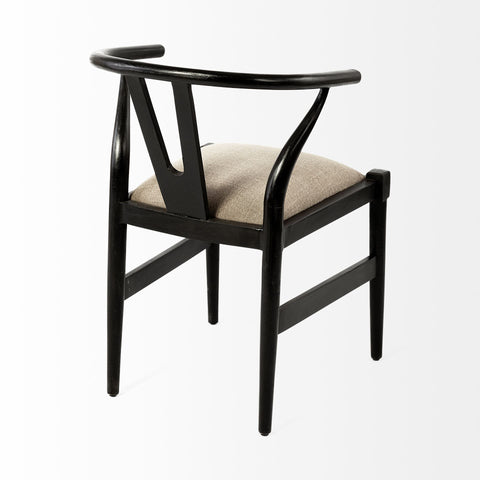 Black chair with beige cushion on a white background