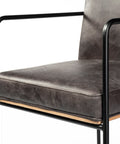 Gray upholstered chair with black metal frame on a white background