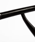Close-up of a black metal pipe on a white background