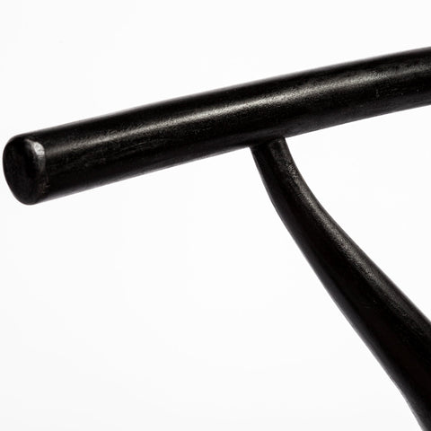 Close-up of a black metal pipe on a white background