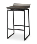 Bar stool with wooden seat and black metal frame on a white background