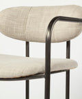 Chair with beige cushioned seat and backrest on a white background