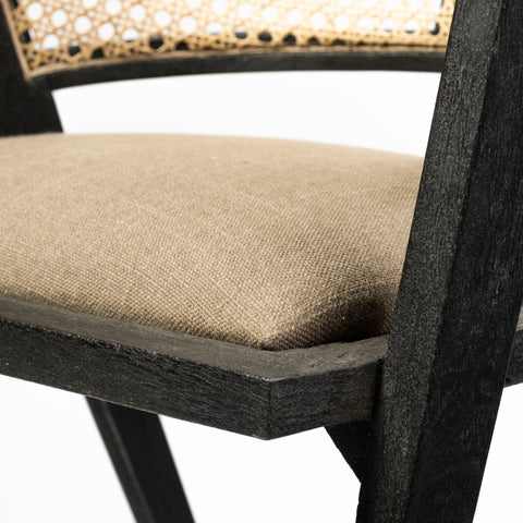 Chair with woven backrest and brown cushion on a white background