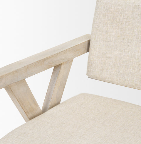 Close-up of a beige chair with wooden armrests on a white background