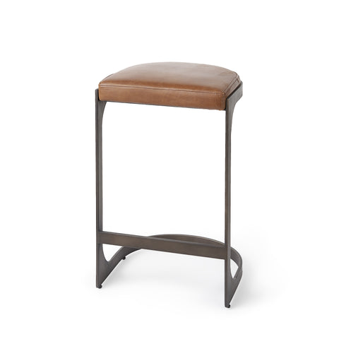 Brown bar stool with a cushioned seat on a white background