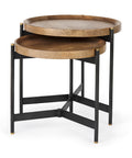 Set of two round wooden tables with black metal stands on a white background