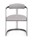 Gray upholstered chair with black metal frame on a white background