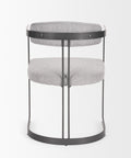Modern side table with gray fabric top and black metal frame on a white background