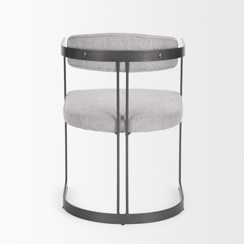 Modern side table with gray fabric top and black metal frame on a white background