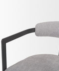 Gray upholstered chair with black metal frame on a white background