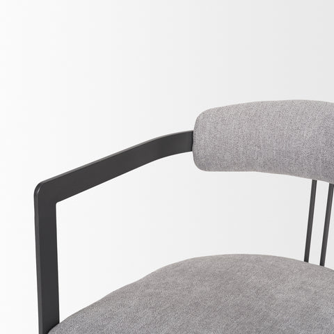 Gray upholstered chair with black metal frame on a white background
