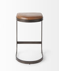 Bar stool with brown leather seat and metal frame on a white background