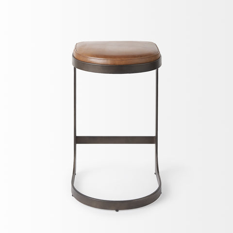 Bar stool with brown leather seat and metal frame on a white background