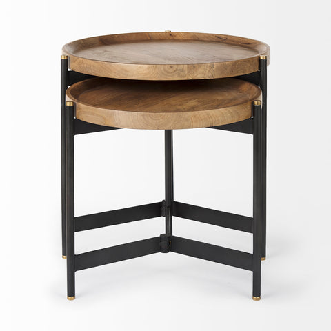 Two-tiered wooden side table with black metal frame on a white background