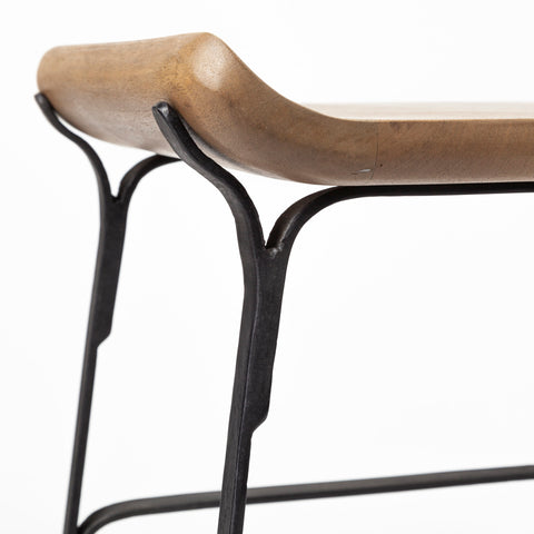 Wooden bench with black metal frame on a white background