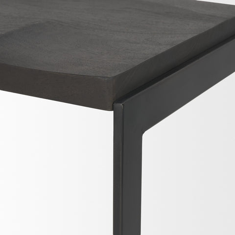 Close-up of a black metal table corner with a gray surface.