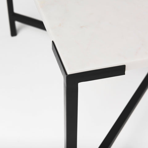Close-up of a black metal chair leg on a white background