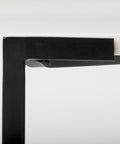 Close-up of a black picture frame corner on a white background