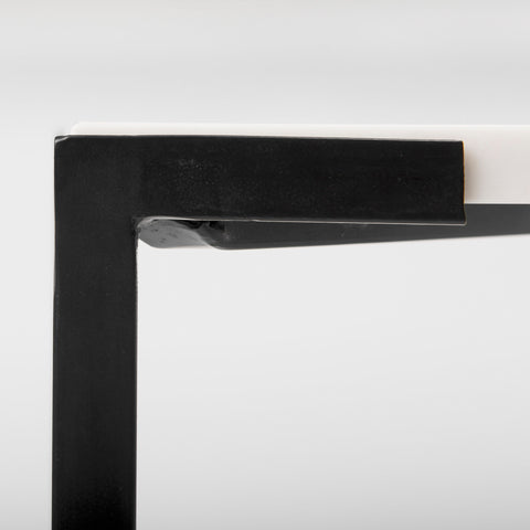 Close-up of a black picture frame corner on a white background