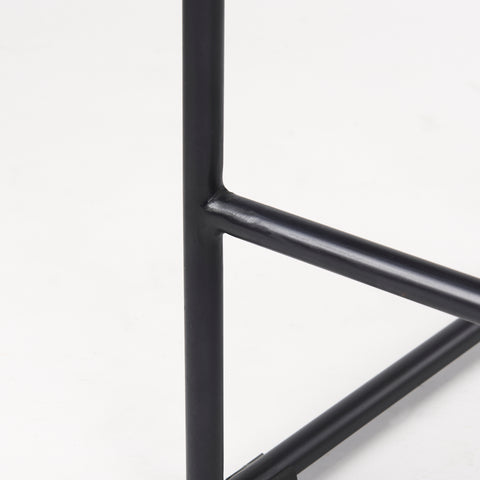Close-up of a black metal frame on a white background