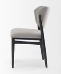 Gray upholstered chair with black legs on a white background