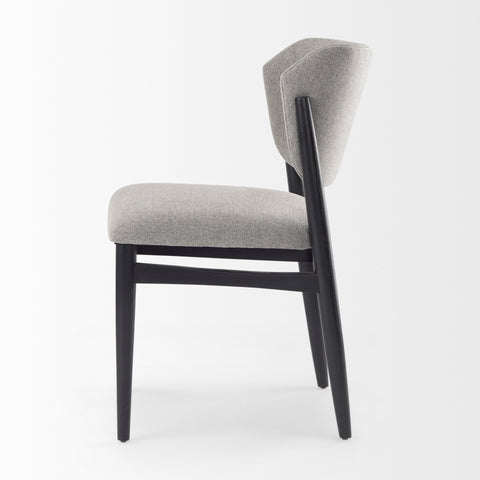 Gray upholstered chair with black legs on a white background