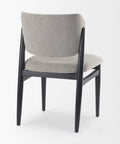 Gray upholstered chair with black frame on a white background