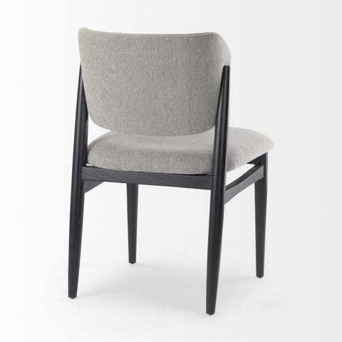 Gray upholstered chair with black frame on a white background