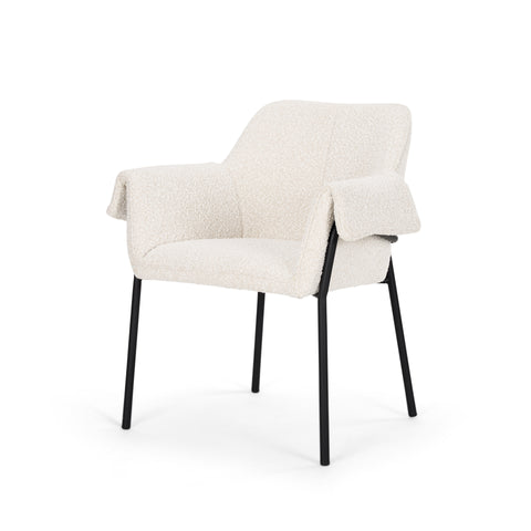 White upholstered chair with black legs on a white background