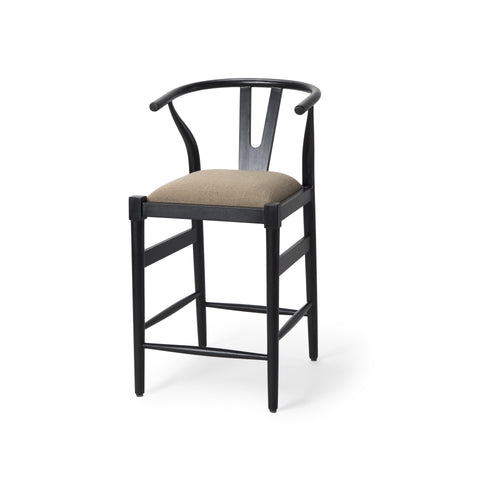 Black bar stool with beige cushion on a white background