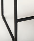 Close-up of a black metal frame on a white background