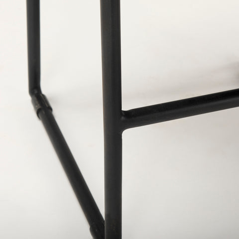 Close-up of a black metal frame on a white background