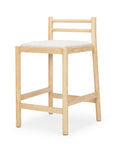 Wooden bar stool with a white cushion on a white background