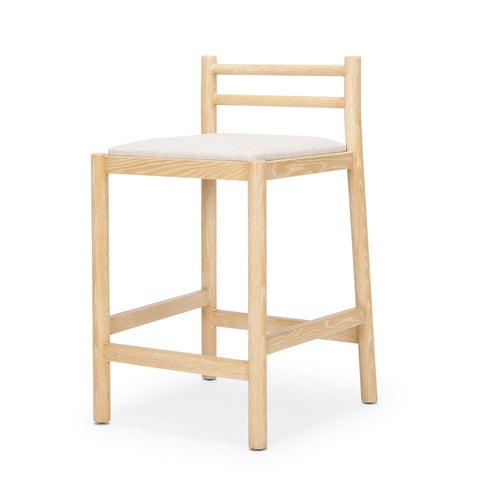 Wooden bar stool with a white cushion on a white background