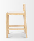Wooden bar stool with a white cushion on a light gray background