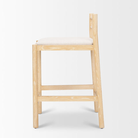 Wooden bar stool with a white cushion on a light gray background